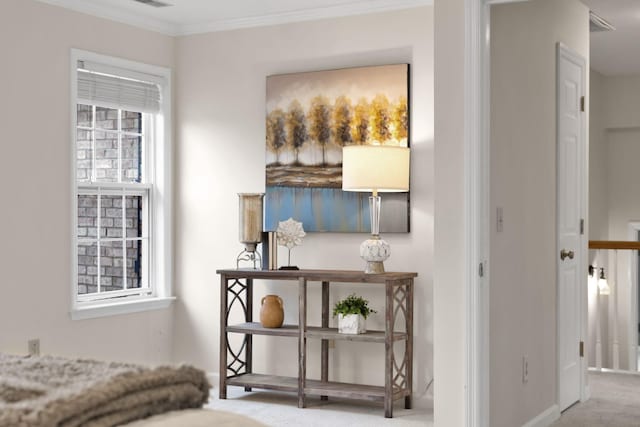 bedroom featuring ornamental molding and light colored carpet