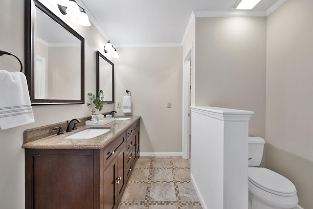 bathroom featuring vanity, ornamental molding, and toilet