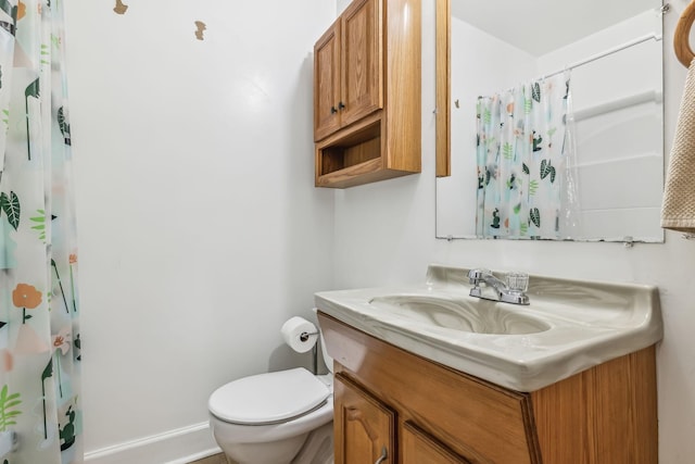 bathroom with vanity, a shower with curtain, and toilet