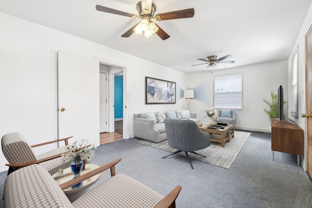 living room featuring ceiling fan and carpet flooring