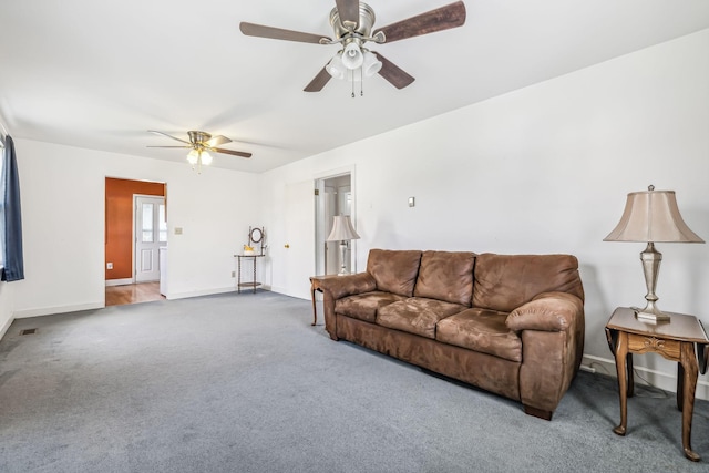 carpeted living room with ceiling fan