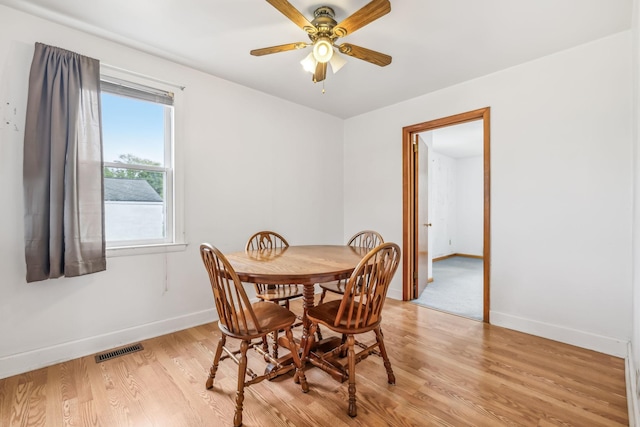 dining space featuring ceiling fan and light hardwood / wood-style flooring