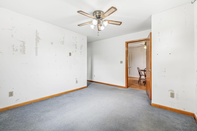 empty room with carpet and ceiling fan