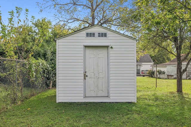 view of outdoor structure with a lawn