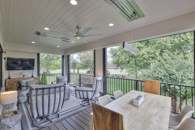 sunroom with wood ceiling and ceiling fan