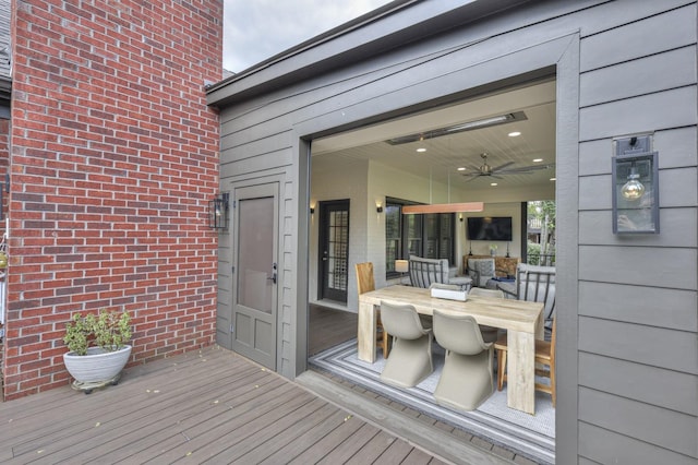 wooden terrace featuring ceiling fan