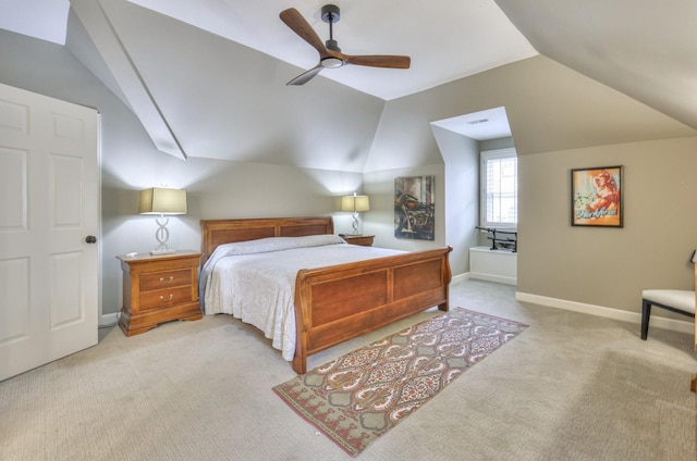 carpeted bedroom with ceiling fan and vaulted ceiling