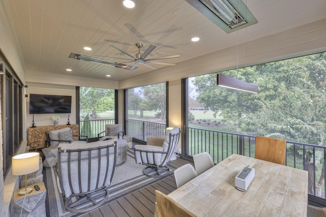 sunroom / solarium with wooden ceiling and ceiling fan