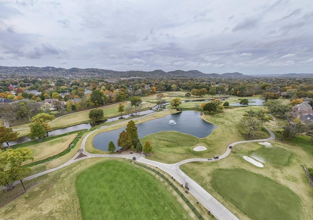 bird's eye view featuring golf course view and a water and mountain view