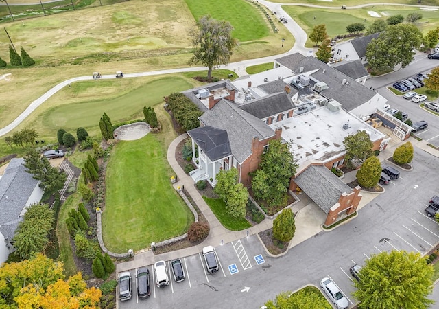 drone / aerial view with a residential view and view of golf course