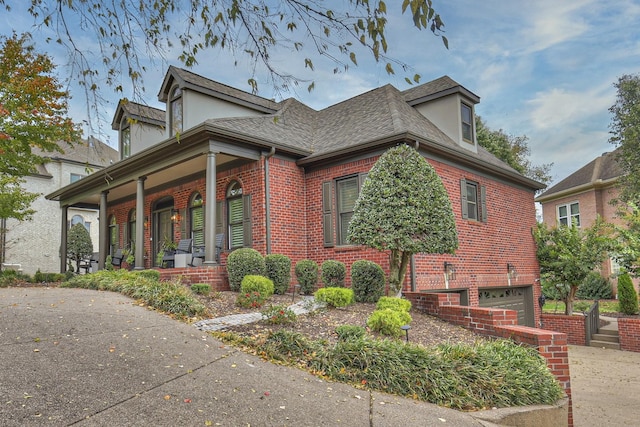 view of front facade featuring a garage and a porch