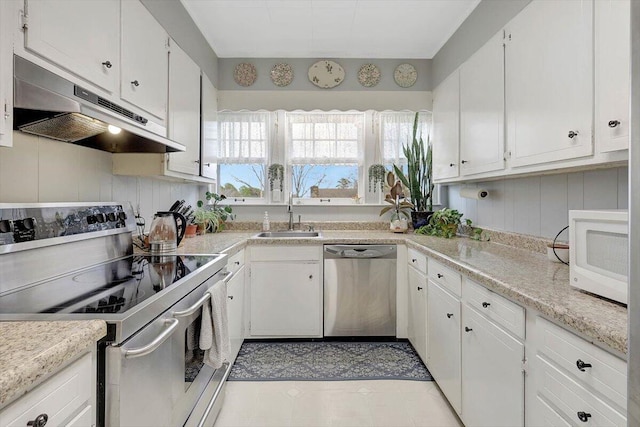 kitchen with white cabinetry, appliances with stainless steel finishes, and sink