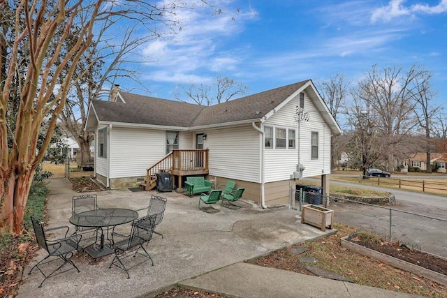 back of property with a patio area