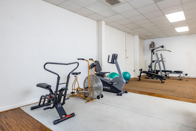 workout room featuring a paneled ceiling