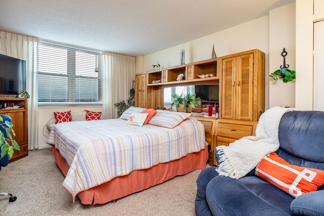 bedroom with multiple windows and carpet floors