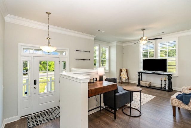 foyer entrance featuring ceiling fan, ornamental molding, and dark hardwood / wood-style floors