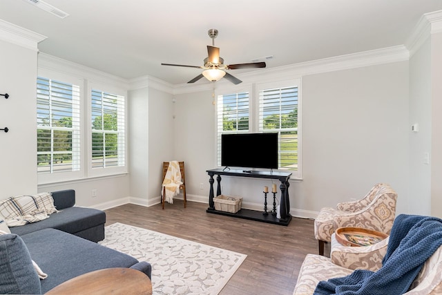 living room featuring crown molding, ceiling fan, and dark wood-type flooring