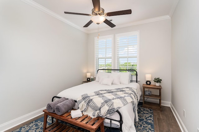 bedroom with crown molding, ceiling fan, and dark hardwood / wood-style flooring