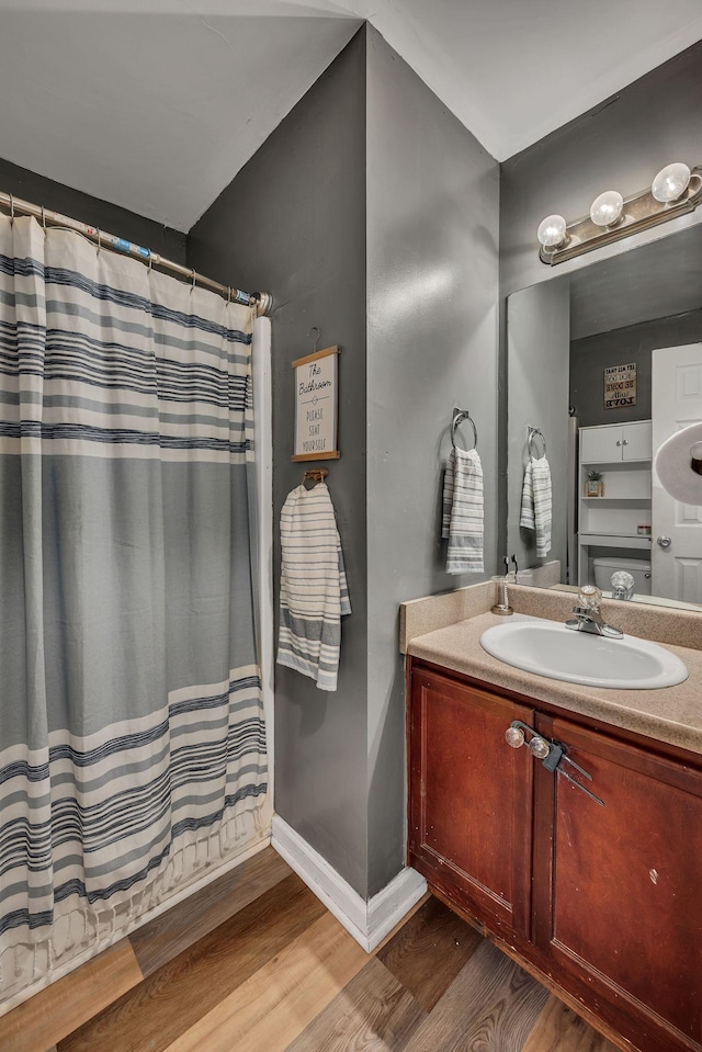 bathroom with vanity and hardwood / wood-style floors