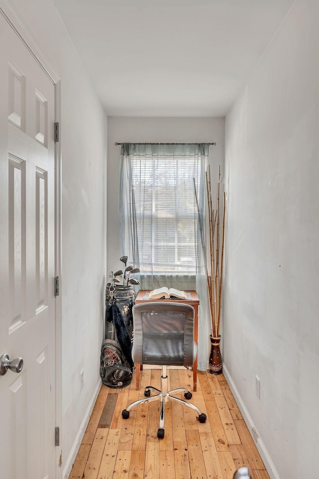 office area with light hardwood / wood-style floors