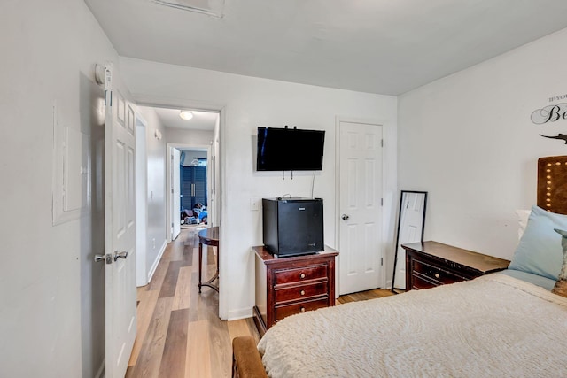 bedroom with light hardwood / wood-style flooring