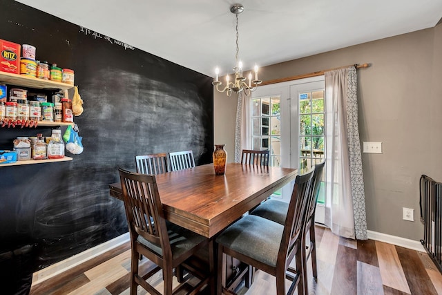 dining space with an inviting chandelier and wood-type flooring