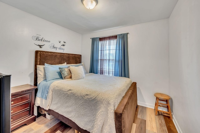 bedroom with light wood-type flooring