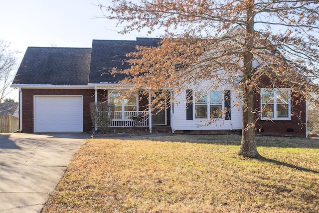 view of front of house with a garage, a porch, and a front yard