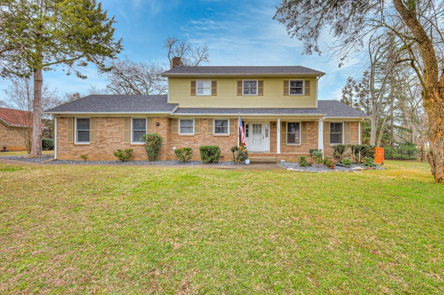 view of front facade featuring a front lawn and covered porch