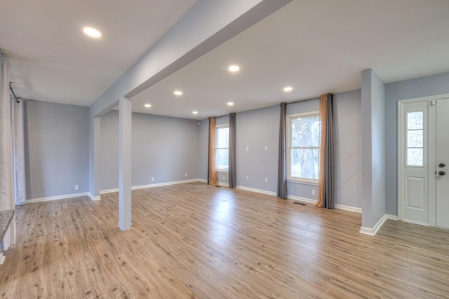 foyer entrance with light hardwood / wood-style flooring