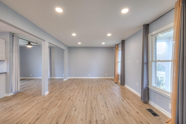 interior space featuring ceiling fan, light hardwood / wood-style flooring, and a wealth of natural light