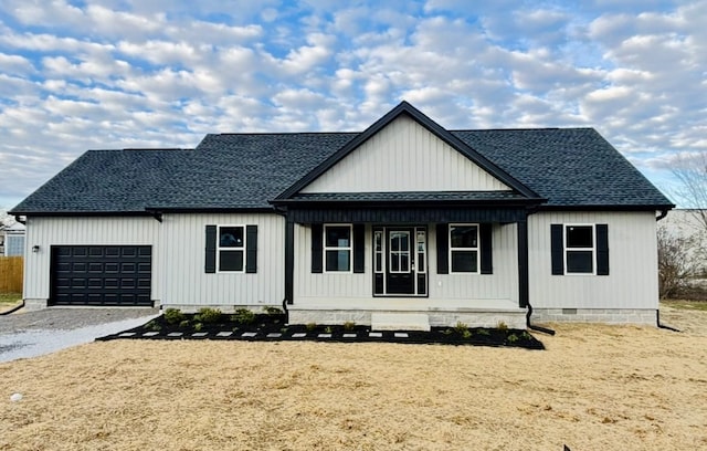 modern farmhouse style home with a garage and a porch