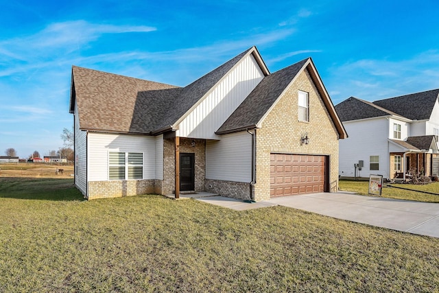 view of front of house with a garage and a front lawn