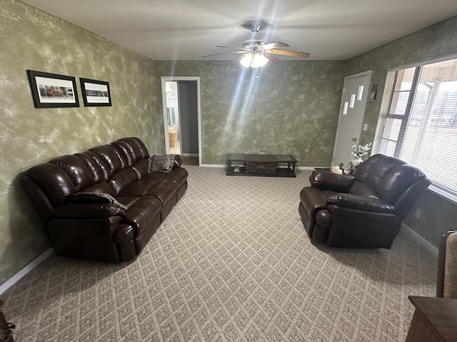 carpeted living room featuring ceiling fan