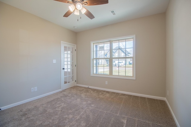 unfurnished room featuring carpet floors and ceiling fan