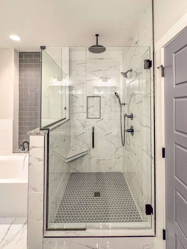 full bath with a garden tub, a shower stall, and recessed lighting