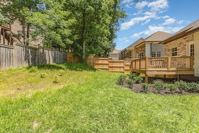 view of yard featuring a wooden deck