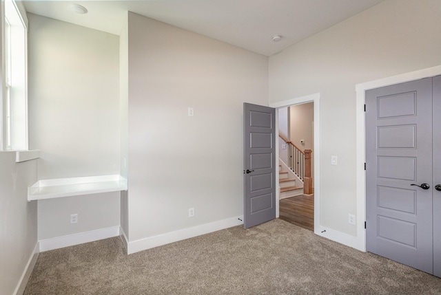 unfurnished bedroom featuring carpet flooring