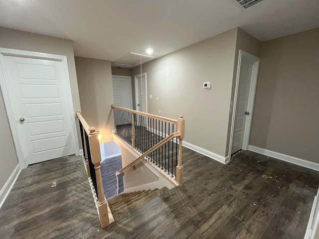 stairway featuring hardwood / wood-style floors