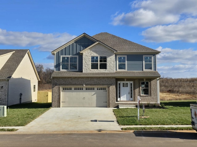 view of front of house featuring a garage and a front lawn