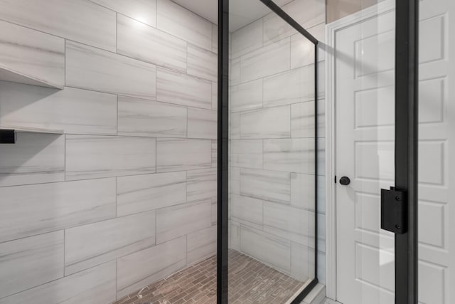 bathroom featuring an enclosed shower