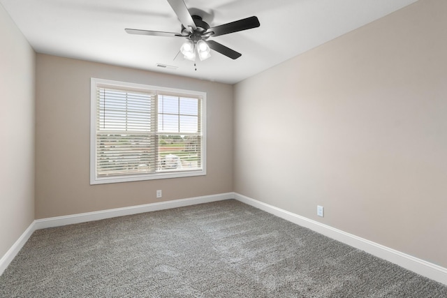 carpeted empty room featuring ceiling fan