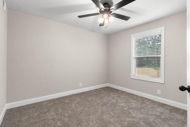 empty room with ceiling fan and carpet flooring