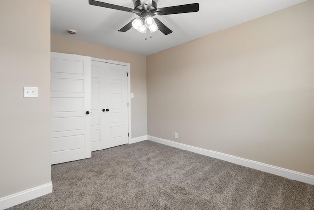 unfurnished bedroom with ceiling fan, a closet, and carpet