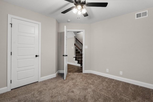 unfurnished bedroom featuring ceiling fan and carpet flooring