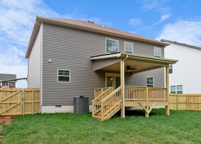 back of house with a wooden deck, a yard, cooling unit, and ceiling fan