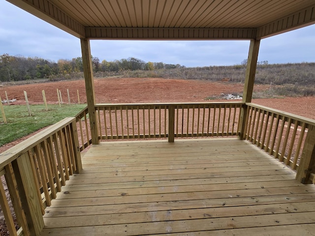 wooden deck featuring a rural view