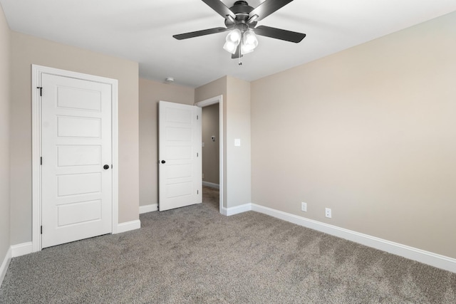 unfurnished bedroom featuring ceiling fan and carpet floors