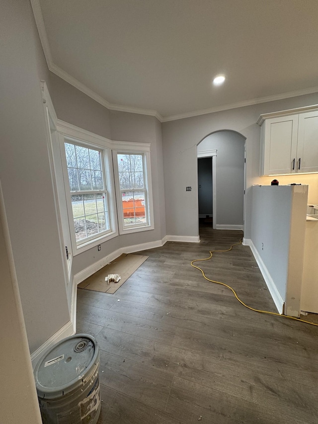 interior space with crown molding and dark wood-type flooring