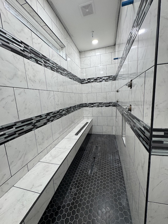 interior space featuring tiled shower